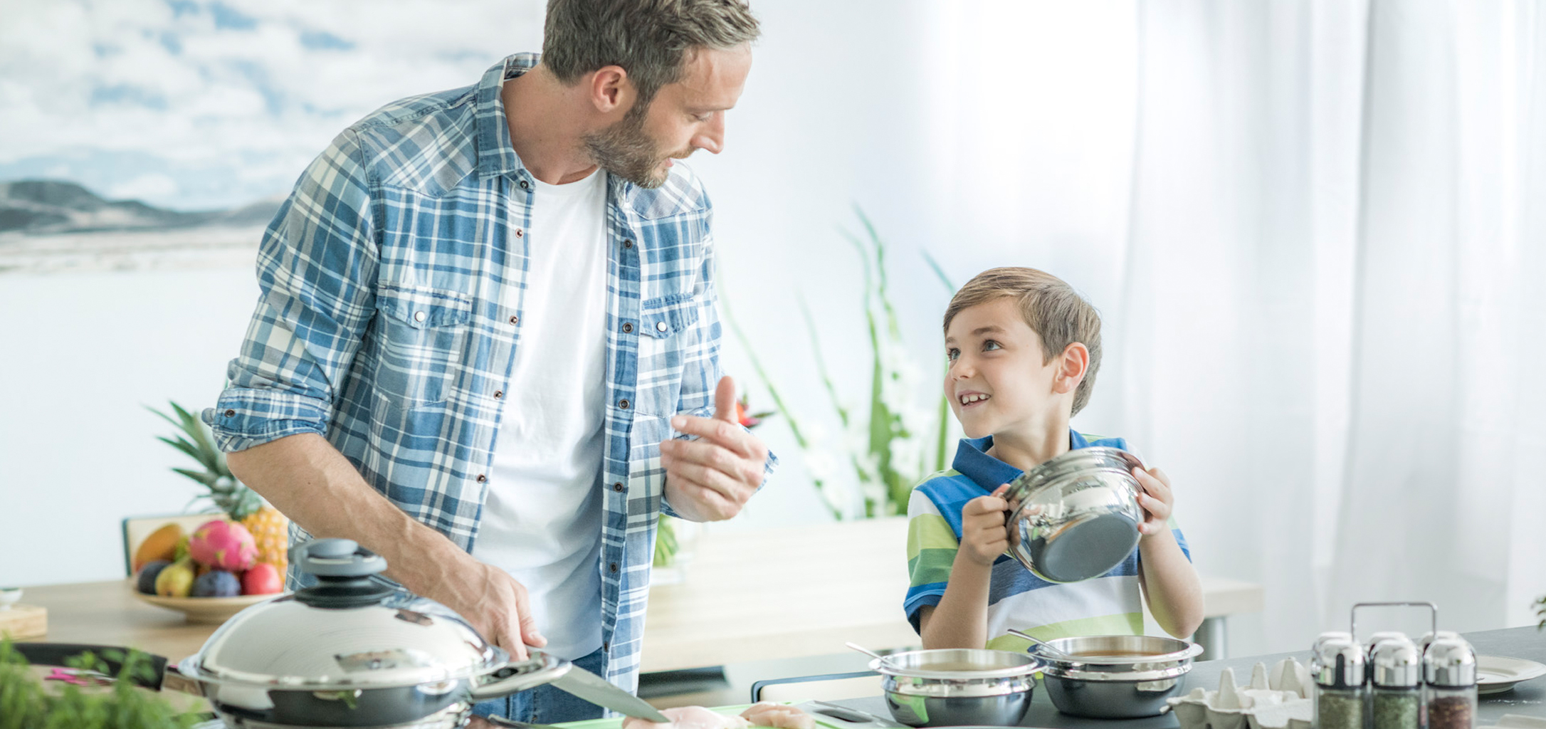 Dad and kid cooking together