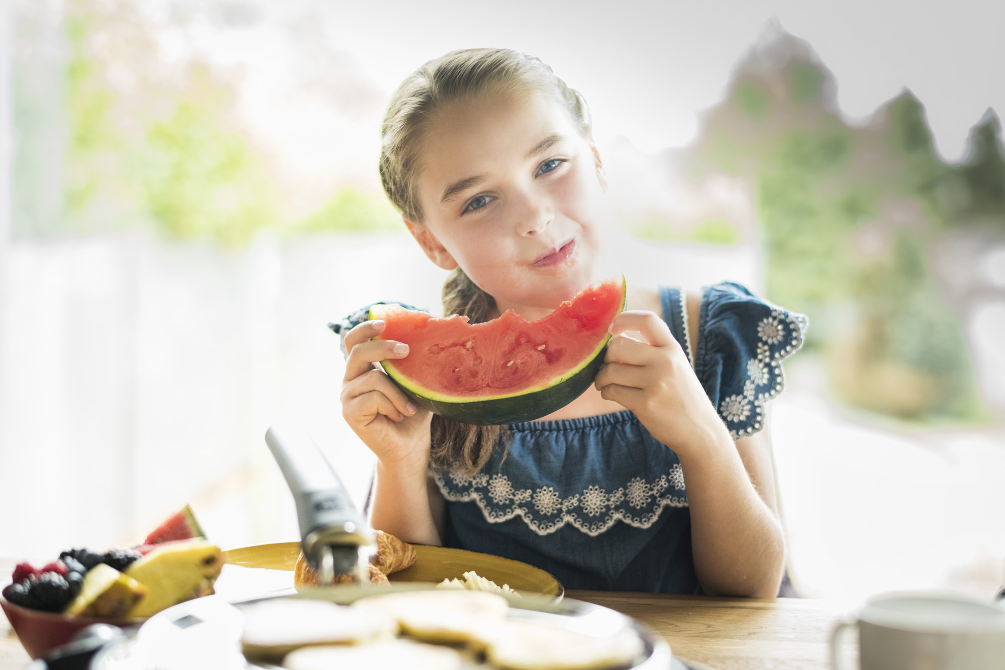 Kid eating a watermelon