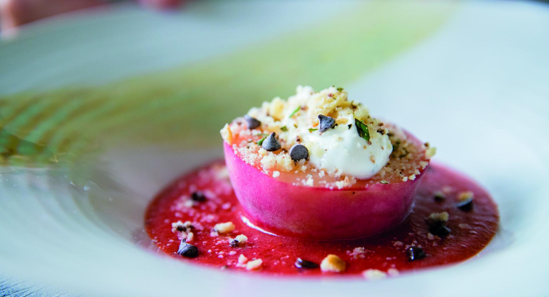 Peach dessert with strawberries and rosemary