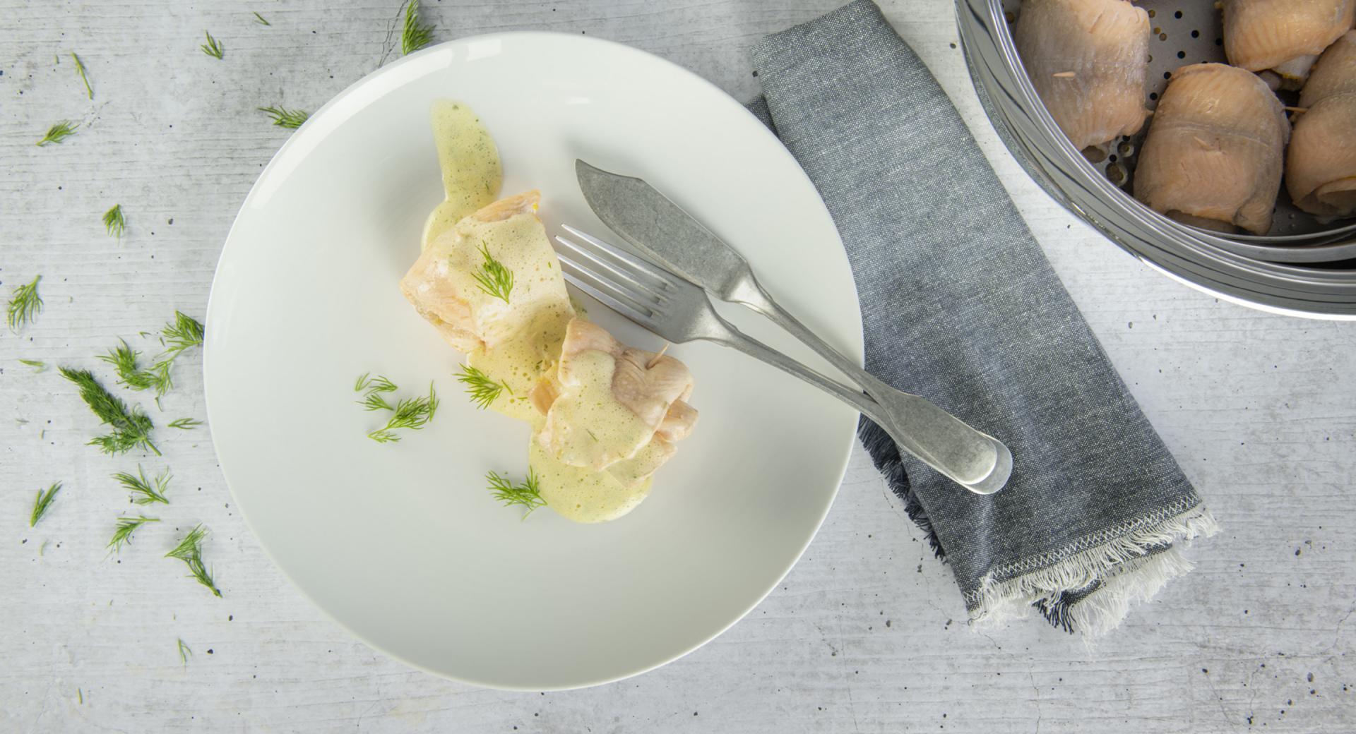 Mini rolls of char served on cucumber and dill foam