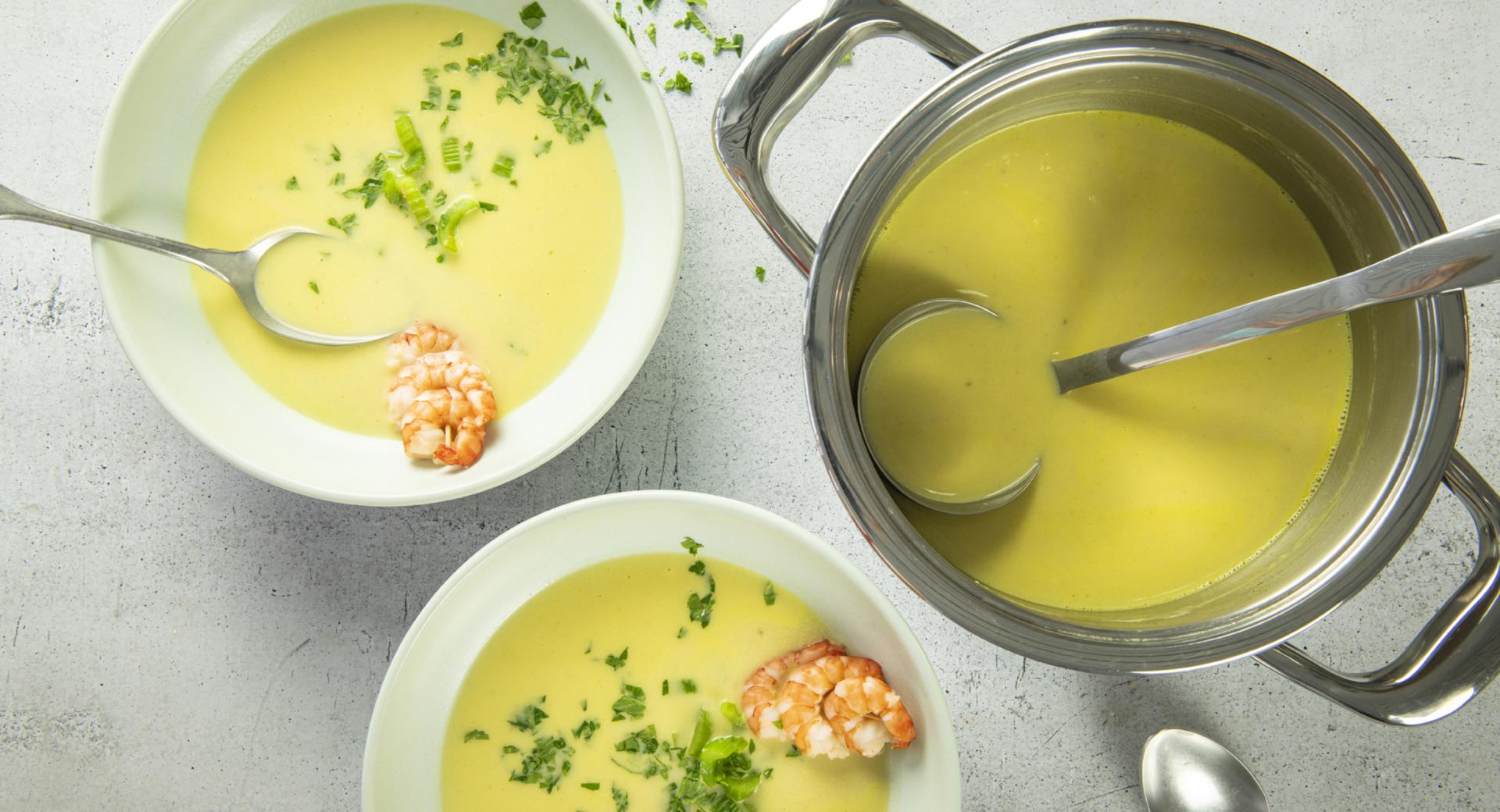 Celery cream soup with shrimp on a skewer