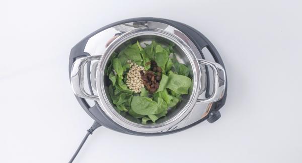 As soon as the Audiotherm beeps on reaching the roasting window, switch off Navigenio, remove pot from heat and add spinach, raisins and pine nuts. Stir until cooked.