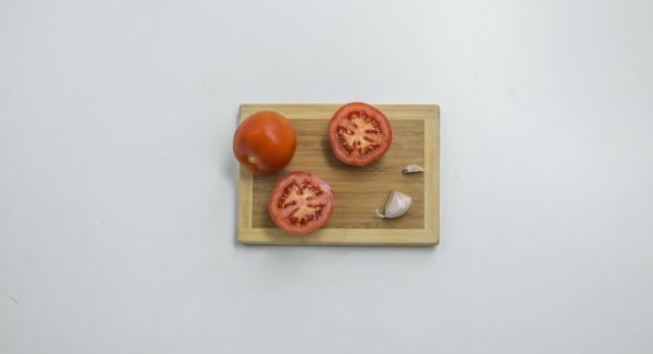 Cut tomatoes in half and cut off an end of the garlic clove.