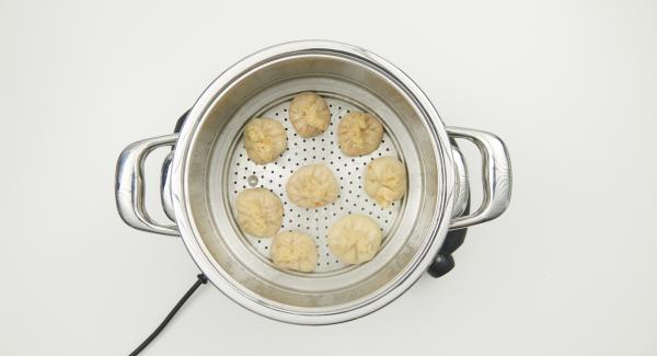 At the end of the cooking time, remove the combi sieve insert and keep Momos warm. Flavour the sauce and serve with the momos.