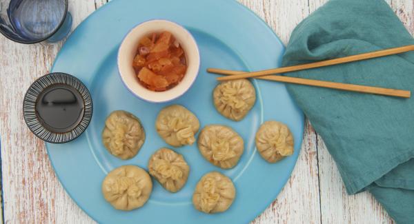 At the end of the cooking time, remove the combi sieve insert and keep Momos warm. Flavour the sauce and serve with the momos.