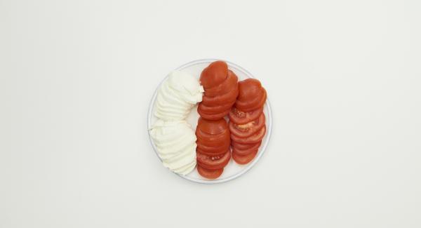 Clean tomatoes and and cut them into slices, also cut mozzarella into slices.