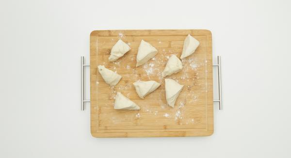 Divide the dough into 8 portions and roll out thinly. Chop sheep's cheese, parsley leaves and chilli flakes in the Quick Cut to prepare a filling. Place a bit of the filling on one side of the dough and fold the other side over.