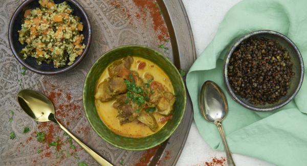 Season the curry and serve sprinkled with coriander.