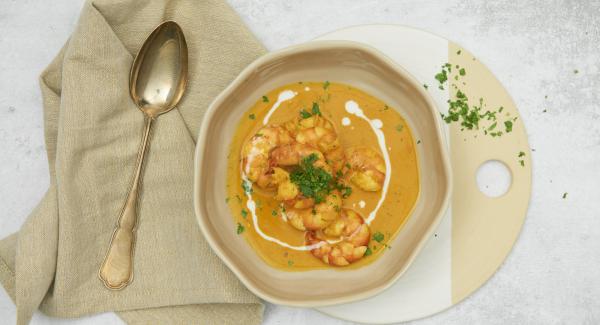 At the end of cooking time season the shrimps and sprinkle with coriander to serve.