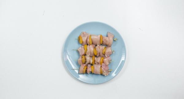 Drain the apricots well, alternate them with chicken on four skewers.