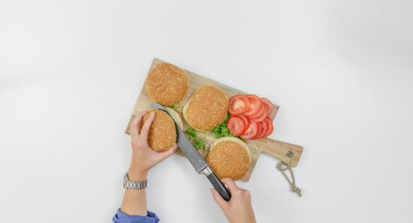 Slice burger buns, clean tomatoes and cut into thin slices.