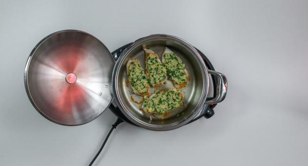 On reaching the turning point at 90 °C flip meat, spread parsley mixture on the meat and press a little.