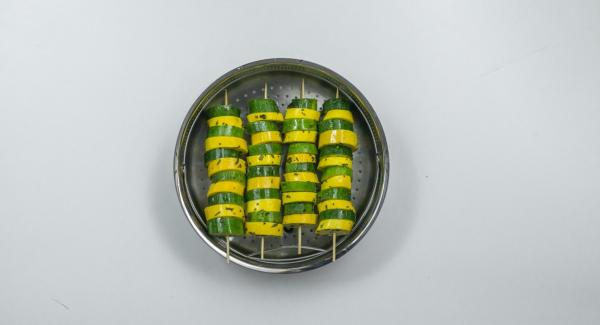 Spear zucchini slices alternately on four wooden skewers and place in a Softiera insert.