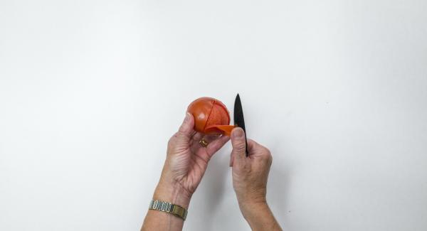 Pour boiling water over the tomatoes, quench, skin and cut into eighths.