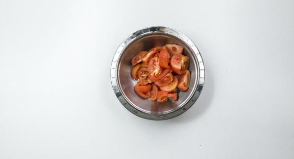 Pour boiling water over the tomatoes, quench, skin and cut into eighths.