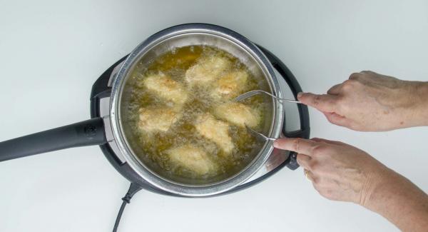 Continue deep-frying the wings with an open lid until a golden brown colour is reached.