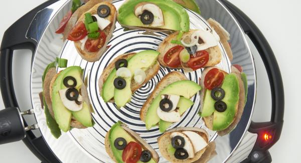 After turning, spread the avocado slices on the roasted bread slices and serve with any garnish.