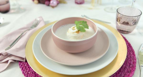 Pass the soup through a sieve at the end of the cooking time and froth up with a hand blender. Place fish rolls in soup plates and arrange with the foamed soup, garnish with cilantro sprigs.