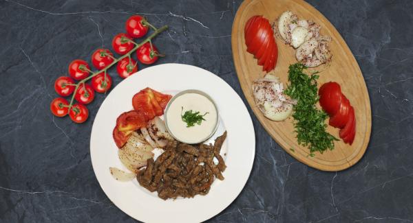 Serve the meat in a plate together with the cooked onion and tomato slices and some tarator dip.