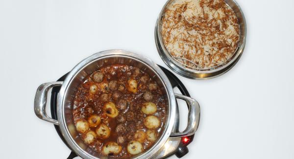 At the end of cooking time, remove Softiera bowl, place it into the inverted lid and serve food.