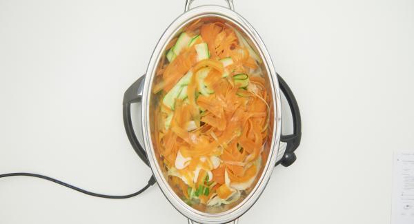 At the end of the cooking time, clean the spring onions and cut into fine rings and sprinkle over to serve.