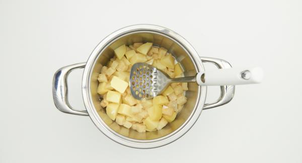 Open Secuquick, remove Softiera insert and pour out the remaining water from the pot. Put the celery and potato cubes back into the pot. Add butter, finely crush celery and potatoes, gradually adding milk.