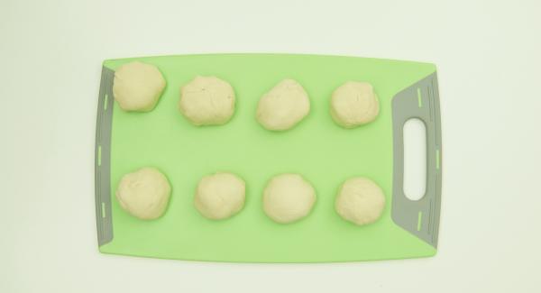 Knead the dough vigorously again, divide into 8-10 small balls and roll out thinly.