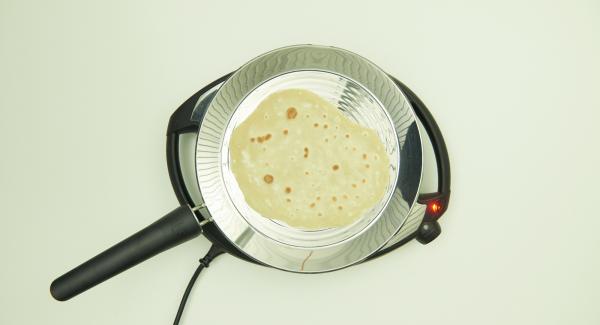 After approx. 2 minutes turn and bake until done. Continue with the remaining Chapati.