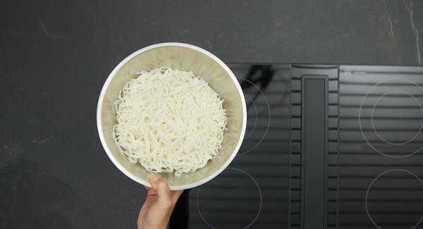 In the meantime, cook the pasta according to the package instructions and drain. Chop the peanuts finely in Quick Cut. Pluck the coriander leaves and cut into fine strips.