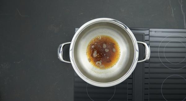 Remove from hob, carefully add the water and simmer until the caramel has dissolved.