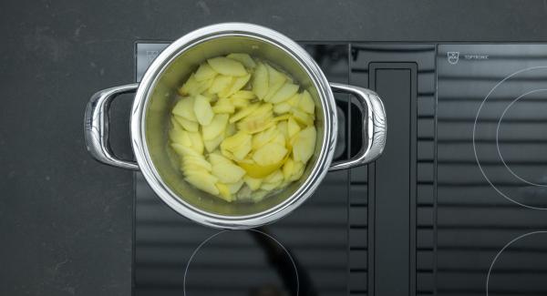 As soon as the Audiotherm beeps on reaching the vegetable window, set at low level and cook until done. Let cool down. Remove lemon peel.