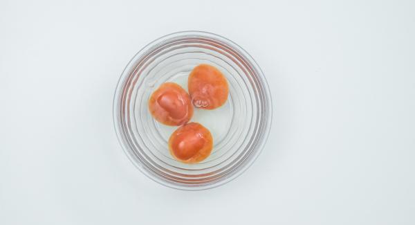 Scald the tomatoes with boiling water, peel them, cut them into small cubes.