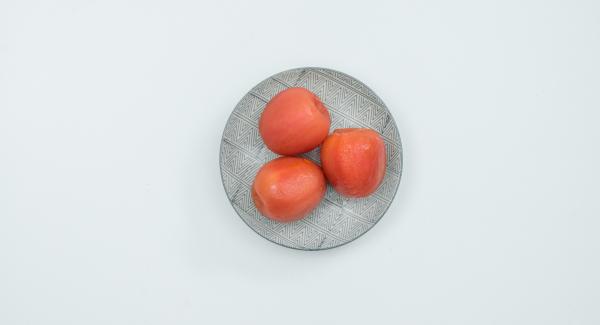 Scald the tomatoes with boiling water, peel them, cut them into small cubes.