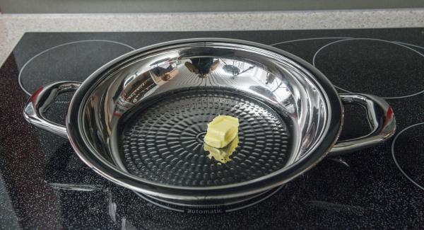 Put butter in a HotPan and switch on the stove at the highest level. As soon as the butter starts to foam, swirl it in the HotPan and place in the potato burger.