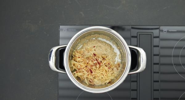 Leave the porridge open for a few minutes and then fold in the grated apple. Drizzle with maple syrup and serve warm.