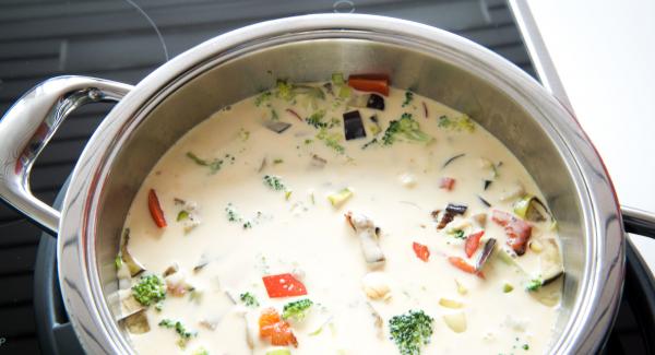 Pour egg and cream mixture over the vegetables and cover with the dough sheet.