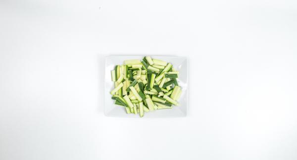 Clean zucchini and cut them into sticks about the size of the pasta.