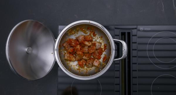 Season with salt, pepper, coriander and cumin. Add tomato paste, roast briefly and deglaze with the red wine and broth.