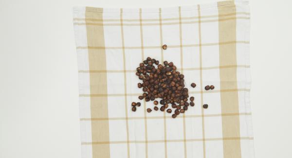 Place the nuts on a clean tea towel, remove the brown skin of the nuts by rubbing them vigorously.