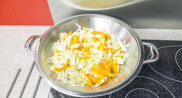 Switch to a low level and add vegetables, mushrooms, ginger and garlic whilst stirring.