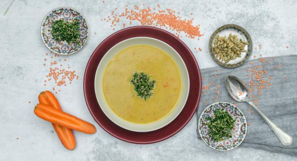 Lentil soup with sesame and herb topping